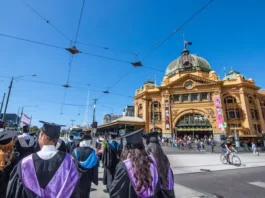 Graduates walking along Swanston Street Melbourne