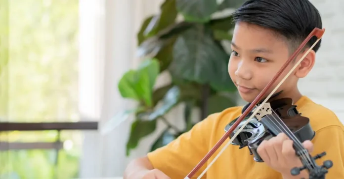 child playing a violin child playing a violin