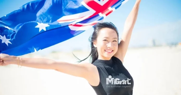 Asian woman holding Australian flag Asian woman holding Australian flag