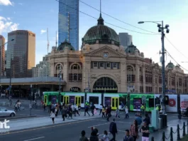 Melbourne's iconic Flinders Street Station with Metro tram on the foreground