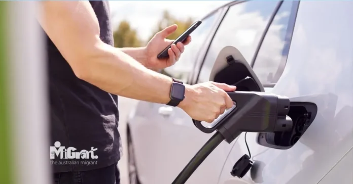 charging an electric car charging an electric car