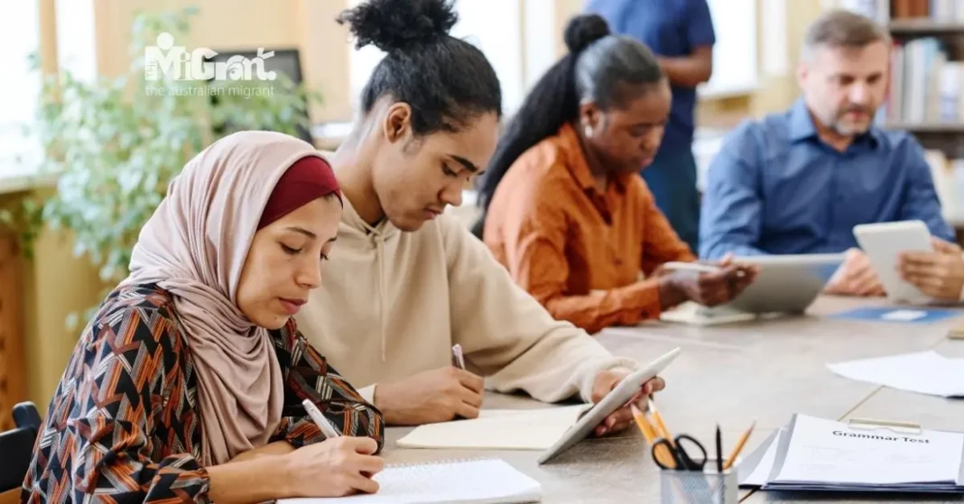 migrants, people of diverse backgrounds, taking grammar test