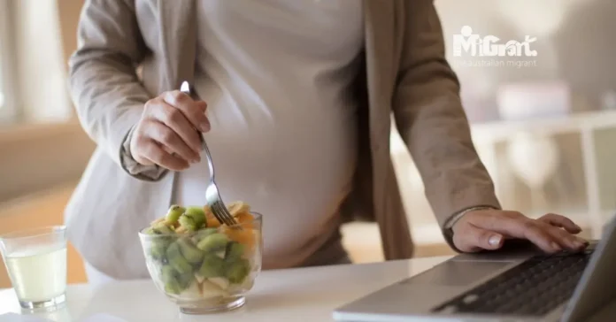 pregnant woman preparing food