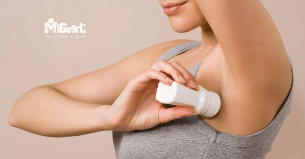 woman applying deodorant